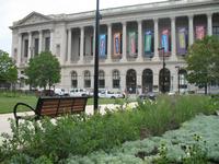 The park features new landscaping, sidewalks, benches, and lighting.